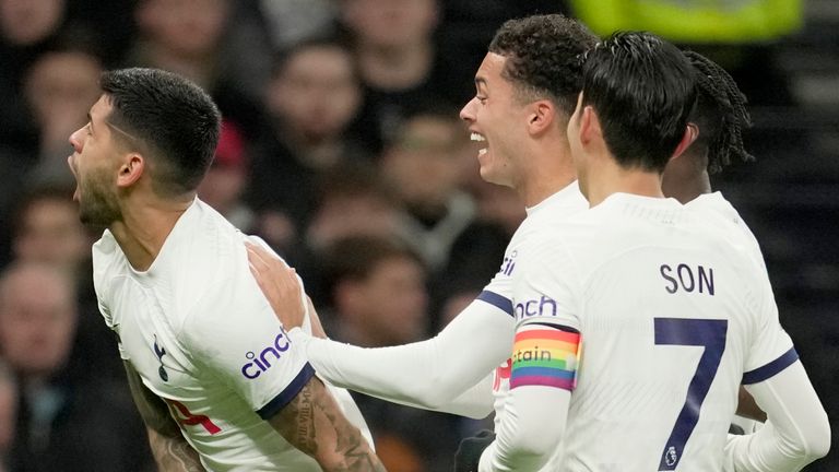 Tottenham&#39;s Cristian Romero, left, celebrates after scoring the opening goal during the English Premier League soccer match between Tottenham Hotspur and West Ham United